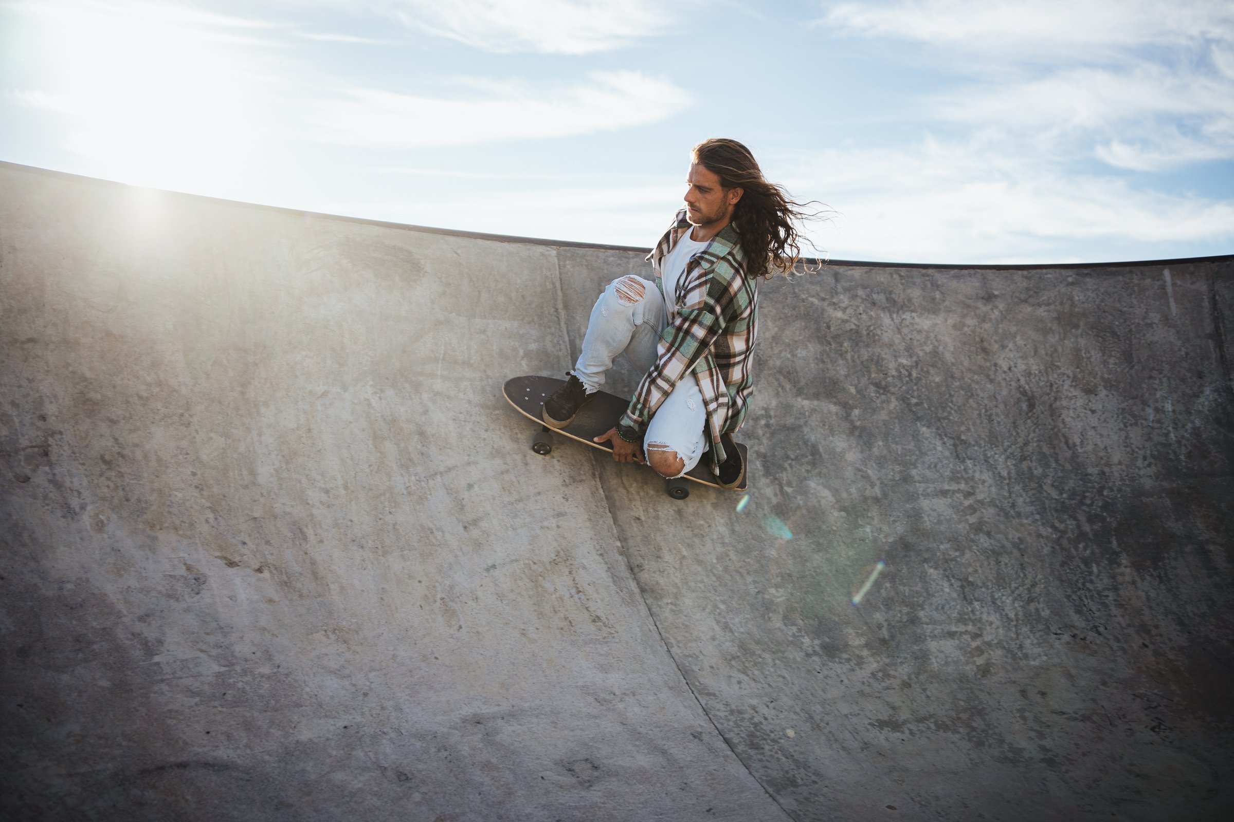 Man practicing skateboarding "surfskate"